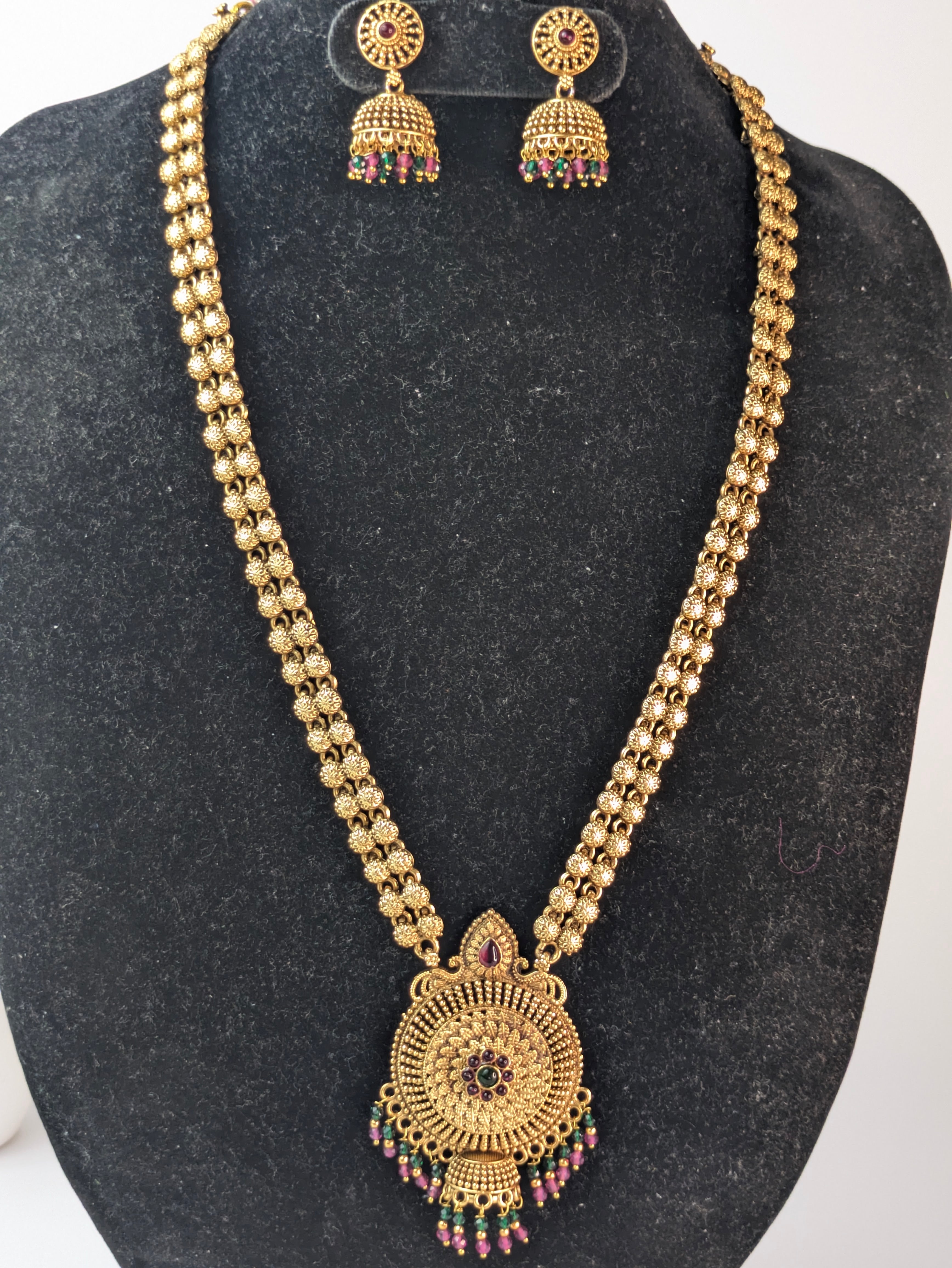 Temple jewelry design with an antique gold-plated finish.