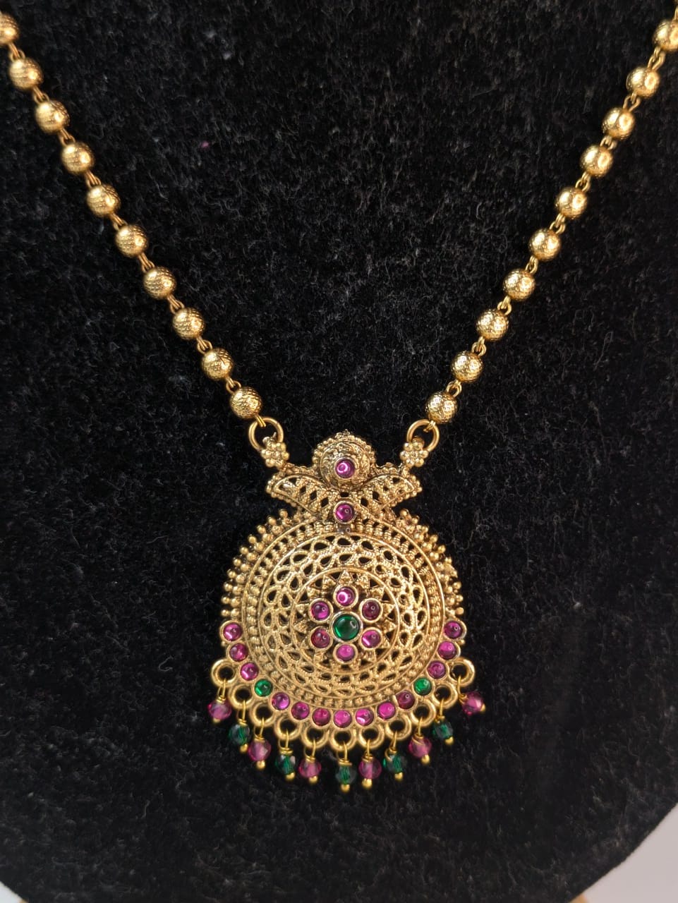 Antique gold-plated finish with vibrant gemstone mid haram