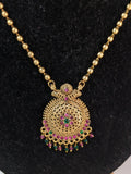 Antique gold-plated finish with vibrant gemstone mid haram